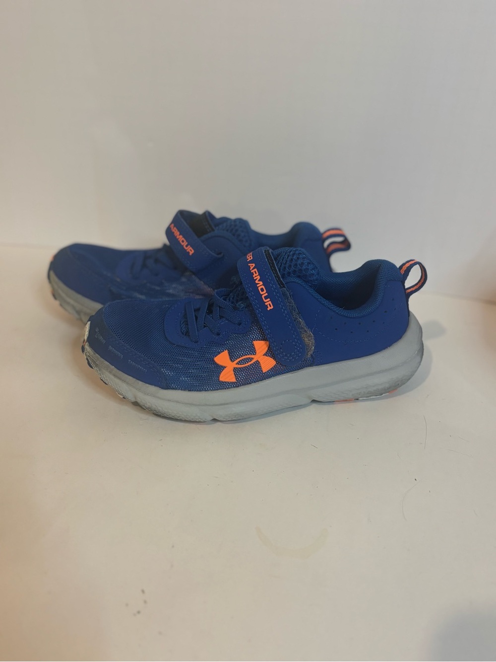 Under Armour Kids Blue Sneakers with Orange Logo